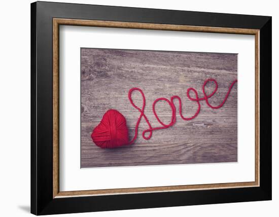 Red Heart of Red Wool Yarn on a Wooden Background-egal-Framed Photographic Print