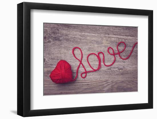 Red Heart of Red Wool Yarn on a Wooden Background-egal-Framed Photographic Print