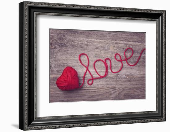 Red Heart of Red Wool Yarn on a Wooden Background-egal-Framed Photographic Print