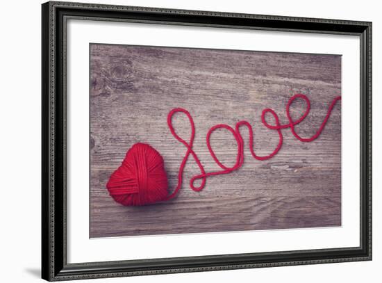 Red Heart of Red Wool Yarn on a Wooden Background-egal-Framed Photographic Print