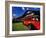 Red Jammer Buses Parked in Front of Glacier Park Lodge in East Glacier, Montana, USA-Chuck Haney-Framed Photographic Print