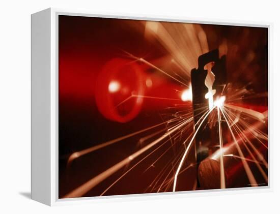 Red Laser Light Focused Through Lens Blasts Pin Point Hole Through Razor in Thousandth of a Second-Fritz Goro-Framed Premier Image Canvas