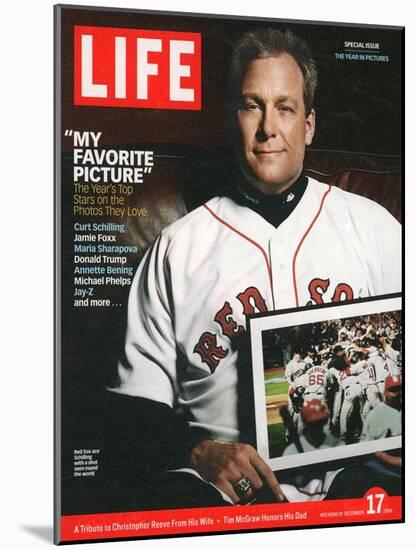 Red Sox Pitcher, Curt Schilling, Holding Photo of 2004 World Series Victory, December 17, 2004-John Huet-Mounted Photographic Print