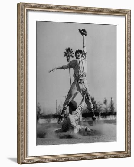 Red Sox's Player in Mid Air Catching the Ball, While an Opposing Player Slides Between His Legs-John Florea-Framed Premium Photographic Print