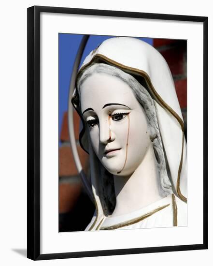 Red Stains are Seen Running from the Left Eye of a Statue of the Virgin Mary-null-Framed Photographic Print