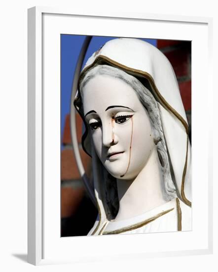 Red Stains are Seen Running from the Left Eye of a Statue of the Virgin Mary-null-Framed Photographic Print