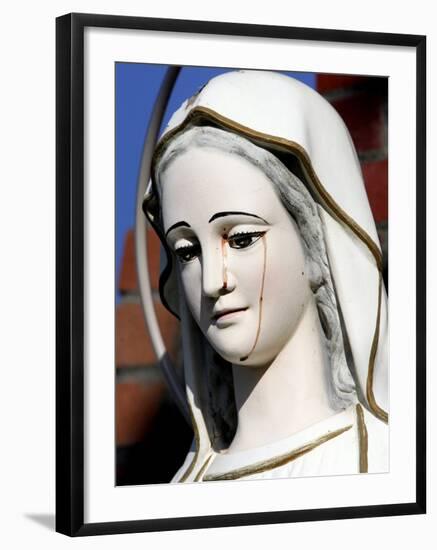 Red Stains are Seen Running from the Left Eye of a Statue of the Virgin Mary-null-Framed Photographic Print