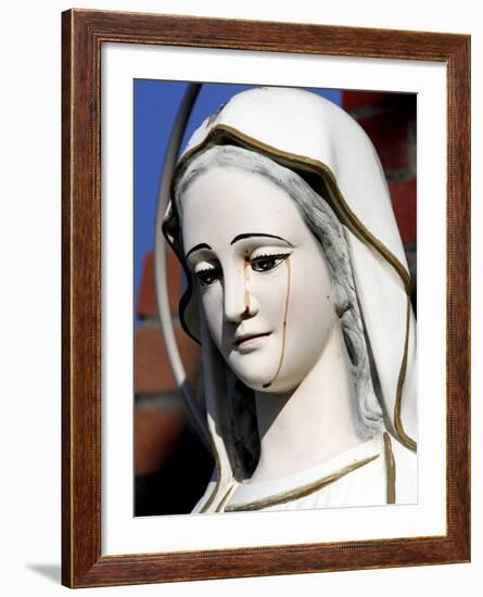 Red Stains are Seen Running from the Left Eye of a Statue of the Virgin Mary-null-Framed Photographic Print