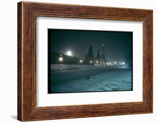 Red Star Atop Kremlin Tower Glowing Against Night-Dim Sky in Snow-Covered, Wintry Moscow, Ussr-Carl Mydans-Framed Photographic Print