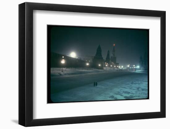 Red Star Atop Kremlin Tower Glowing Against Night-Dim Sky in Snow-Covered, Wintry Moscow, Ussr-Carl Mydans-Framed Photographic Print