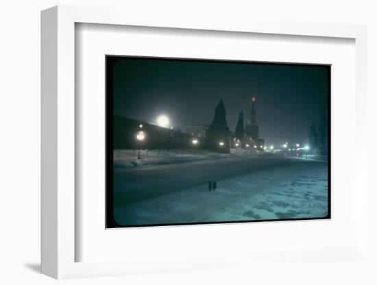 Red Star Atop Kremlin Tower Glowing Against Night-Dim Sky in Snow-Covered, Wintry Moscow, Ussr-Carl Mydans-Framed Photographic Print