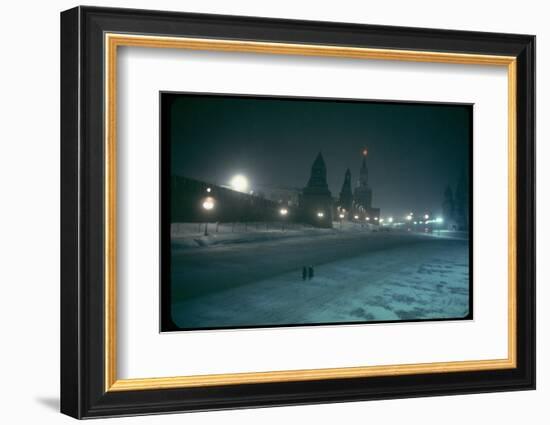 Red Star Atop Kremlin Tower Glowing Against Night-Dim Sky in Snow-Covered, Wintry Moscow, Ussr-Carl Mydans-Framed Photographic Print