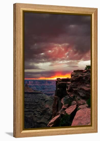 Red sunset with moody clouds and red rock canyons in Dead Horse Point State Park near Moab, Utah-David Chang-Framed Premier Image Canvas