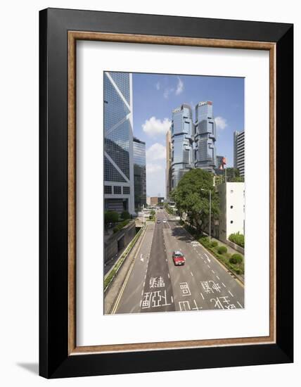 Red taxi cab in Central, Hong Kong Island, with the Bank of China Tower and Lippo Centre beyond, Ho-Fraser Hall-Framed Photographic Print