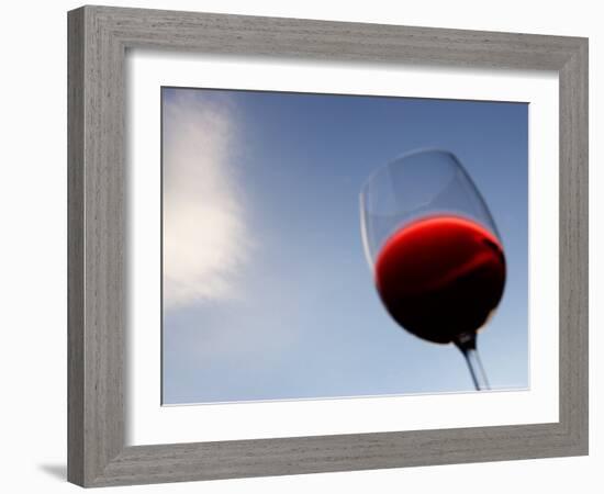 Red Wine Glass Against a Blue Sky, Paris, France-Michele Molinari-Framed Photographic Print