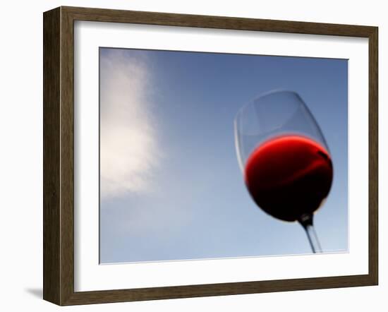 Red Wine Glass Against a Blue Sky, Paris, France-Michele Molinari-Framed Photographic Print