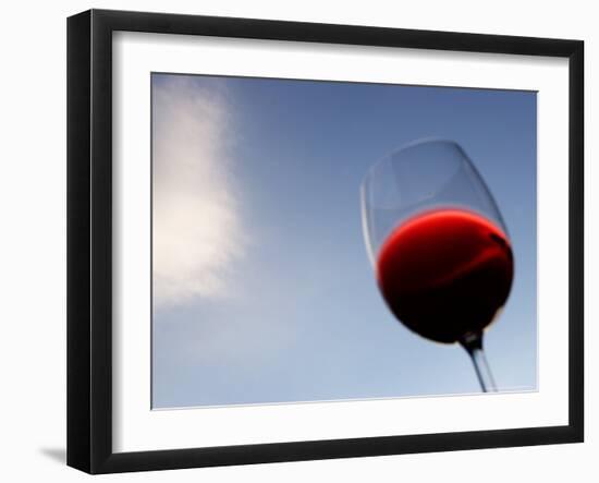 Red Wine Glass Against a Blue Sky, Paris, France-Michele Molinari-Framed Photographic Print