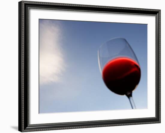 Red Wine Glass Against a Blue Sky, Paris, France-Michele Molinari-Framed Photographic Print