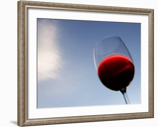 Red Wine Glass Against a Blue Sky, Paris, France-Michele Molinari-Framed Photographic Print