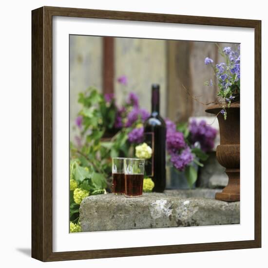 Red Wine Glasses & Red Wine Bottle on Stone Trough with Flowers-Christine Gill?-Framed Photographic Print