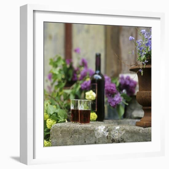 Red Wine Glasses & Red Wine Bottle on Stone Trough with Flowers-Christine Gill?-Framed Photographic Print