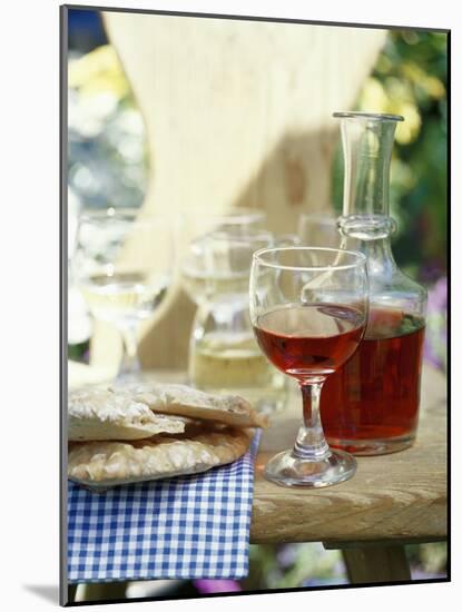 Red Wine in Glass and Carafe, Schüttelbrot Beside (S. Tyrol)-Eising Studio - Food Photo and Video-Mounted Photographic Print