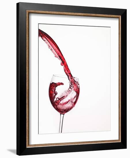 Red Wine Pouring into a Glass from Bottle-null-Framed Photographic Print