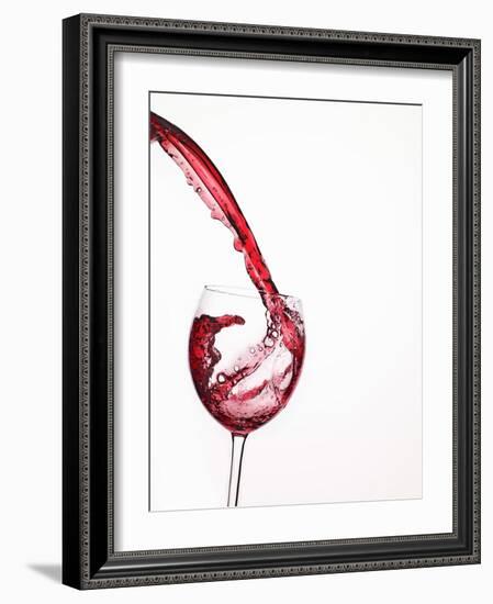 Red Wine Pouring into a Glass from Bottle-null-Framed Photographic Print