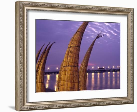 Reed Boats are Stacked Along the Beach at the Fishing Village of Huanchaco in Northern Peru-Andrew Watson-Framed Photographic Print