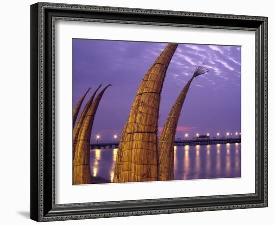 Reed Boats are Stacked Along the Beach at the Fishing Village of Huanchaco in Northern Peru-Andrew Watson-Framed Photographic Print