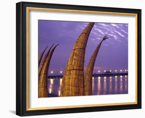 Reed Boats are Stacked Along the Beach at the Fishing Village of Huanchaco in Northern Peru-Andrew Watson-Framed Photographic Print