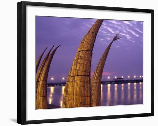 Reed Boats are Stacked Along the Beach at the Fishing Village of Huanchaco in Northern Peru-Andrew Watson-Framed Photographic Print