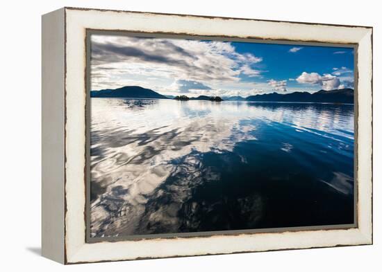 Reflections in the calm waters of the Inside Passage, Southeast Alaska, USA-Mark A Johnson-Framed Premier Image Canvas