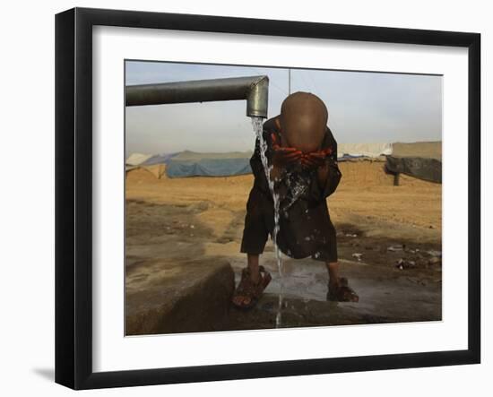 Refugee Washes His Face in a Refugee Camp in the Outskirts of Kabul, Afghanistan-null-Framed Photographic Print