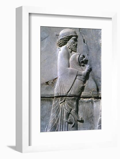 Relief of a man holding a lion cub, Persepolis, Iran-Vivienne Sharp-Framed Photographic Print