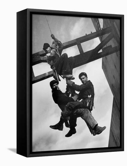 Relief Workers Hanging from Cable in Front of a Giant Beam During the Construction of Fort Peck Dam-Margaret Bourke-White-Framed Premier Image Canvas