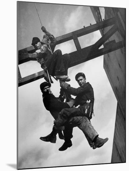 Relief Workers Hanging from Cable in Front of a Giant Beam During the Construction of Fort Peck Dam-Margaret Bourke-White-Mounted Premium Photographic Print