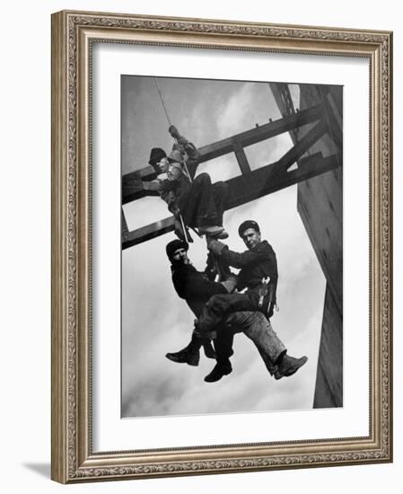 Relief Workers Hanging from Cable in Front of a Giant Beam During the Construction of Fort Peck Dam-Margaret Bourke-White-Framed Photographic Print