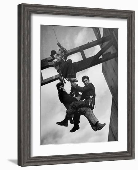 Relief Workers Hanging from Cable in Front of a Giant Beam During the Construction of Fort Peck Dam-Margaret Bourke-White-Framed Photographic Print