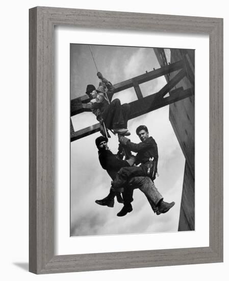 Relief Workers Hanging from Cable in Front of a Giant Beam During the Construction of Fort Peck Dam-Margaret Bourke-White-Framed Photographic Print