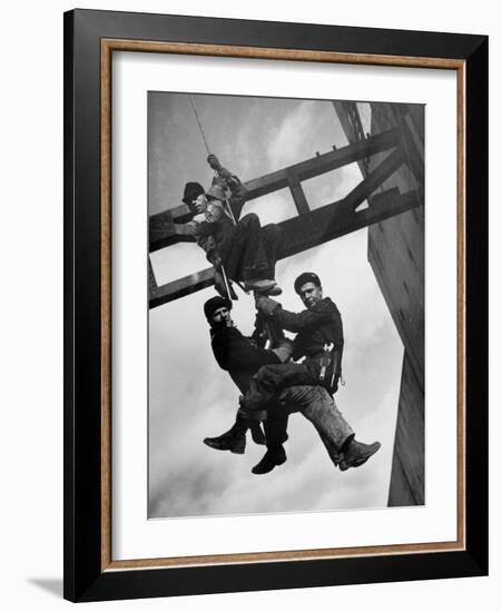 Relief Workers Hanging from Cable in Front of a Giant Beam During the Construction of Fort Peck Dam-Margaret Bourke-White-Framed Photographic Print