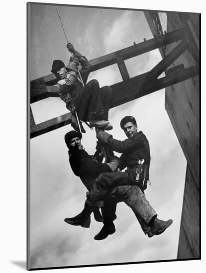 Relief Workers Hanging from Cable in Front of a Giant Beam During the Construction of Fort Peck Dam-Margaret Bourke-White-Mounted Photographic Print