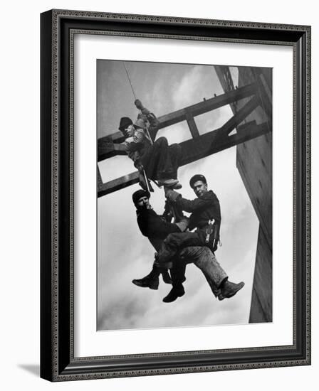 Relief Workers Hanging from Cable in Front of a Giant Beam During the Construction of Fort Peck Dam-Margaret Bourke-White-Framed Photographic Print