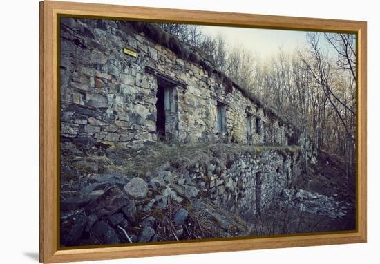 Remains of a bunker with door and windows at a mountain in a wood in winter in Alsace-Axel Killian-Framed Premier Image Canvas