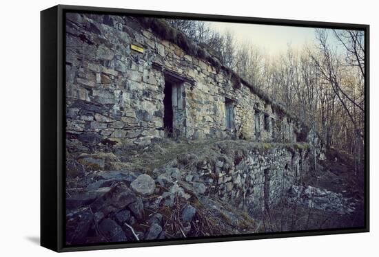 Remains of a bunker with door and windows at a mountain in a wood in winter in Alsace-Axel Killian-Framed Premier Image Canvas