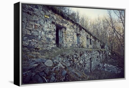 Remains of a bunker with door and windows at a mountain in a wood in winter in Alsace-Axel Killian-Framed Premier Image Canvas