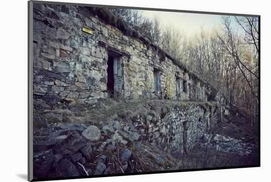 Remains of a bunker with door and windows at a mountain in a wood in winter in Alsace-Axel Killian-Mounted Photographic Print