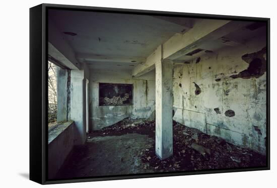 Remains of the interior of a kitchen of a bunker on a mountain in a wood in winter in Alsace-Axel Killian-Framed Stretched Canvas