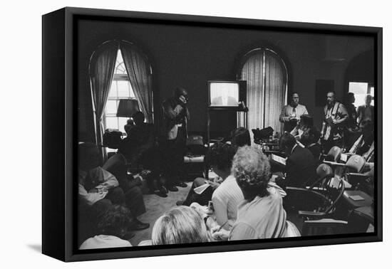 Reporters watch President Carter making TV announcement on aborted Iran rescue, 1980-Marion S. Trikosko-Framed Premier Image Canvas