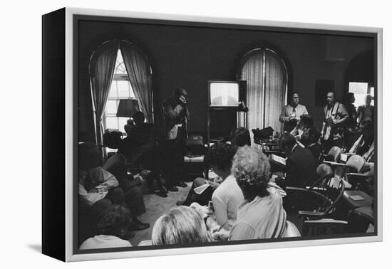 Reporters watch President Carter making TV announcement on aborted Iran rescue, 1980-Marion S. Trikosko-Framed Premier Image Canvas